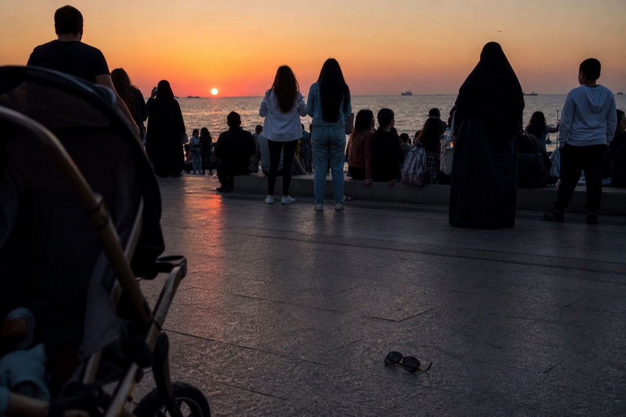Crowds gathered along the Key West waterfront at dusk watching the sunset over the water, no text, no logos, no people